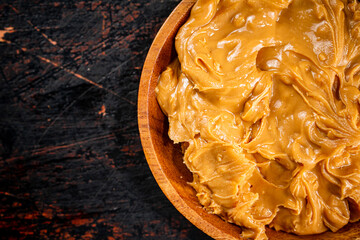 Canvas Print - A plate of peanut butter on the table. 