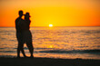 Young couple spending time together on the beach. Photo out of focus