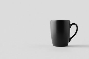 Wall Mural - Black curved mug mockup with blank copyspace.