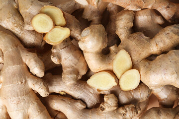 Wall Mural - Texture of fresh ginger roots as background