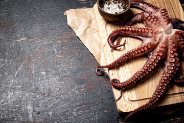 Sticker - Octopus on a wooden cutting board. 