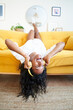 © CarlosBarquero - Vertical photo of Beautiful young woman at home enjoys listening music with headphones. High quality photo