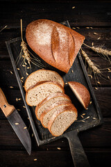 Canvas Print - Sliced bread on a cutting board. 