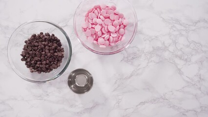 Wall Mural - Time lapse. Flat lay. Step by step. Ingredients for melting chocolate chips in chocolate melting pots on kitchen counter.