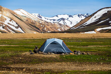 Surreal Icelandic Volcanic Mountain With Hiker Tent, 4x4 Vehicle Camping On Campsite In Summer At Central Of Iceland