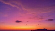 Time Lapse Of Majestic Sunset Light Sky Over Sea Landscape,Amazing Light Of Nature Cloudscape Sky And Clouds Moving Away Rolling 4K High Quality Timelapse,Colorful Sunset Or Sunrise Light Sky
