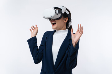 Wall Mural - Happy young Asian businesswoman working in virtual reality environment in VR glasses touching virtual interface isolated on white background.