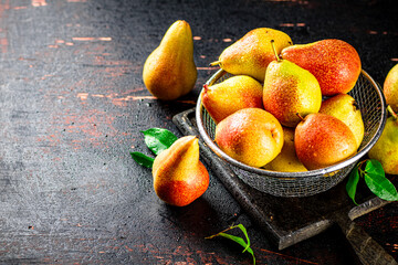 Poster - Ripe pears in a colander. 