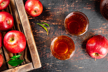 Sticker - A glass of apple juice on the table. 