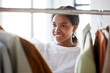 © Joshua A/peopleimages.com - Shopping, fashion and retail woman in store for sale, discount or student promotion and search rail for product. Clothes, boutique and person, customer or client with wardrobe inspiration or ideas