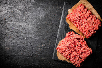 Sticker - Raw minced meat on a stone board. 