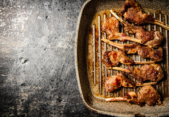 Sticker - Fragrant grilled lamb rack on a stone board. 