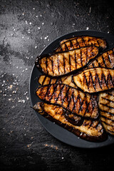 Poster - Slices of eggplant grilled in a plate. 