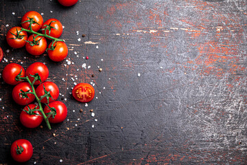 Wall Mural - A branch of fresh tomatoes with pieces of salt. 