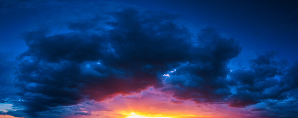 Wall Mural - Clouds at sunset. Blue and orange. A wonderful natural background.