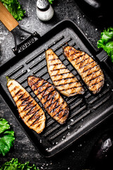 Sticker - Slices of eggplant in a grill pan. 