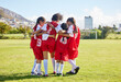 © Nina/peopleimages.com - Diversity, sports girl hug and soccer field training for youth competition match playing at stadium grass. Team, young athlete or player enjoy football teamwork or support world cup championship