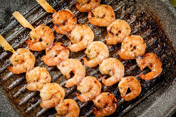 Wall Mural - Grilled shrimp in a frying pan. 