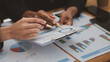 © PHOTO4U - The sales department is having a monthly summary meeting to bring it to the department manager, they are verifying the correctness of the documents that are prepared before bringing in to the manager