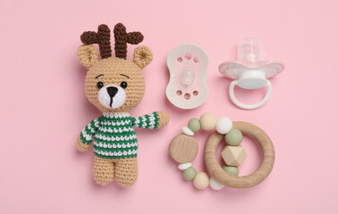 Poster - Flat lay composition with pacifiers and other baby stuff on pink background