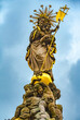 Great close-up view of the Madonna statue on the square Kornmarkt (Corn Market) in the old town of Heidelberg, Germany. The baroque statue sits on the top of the Muttergottesbrunnen fountain.
