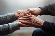 © Oksana Klymenko - Closeup of hands of old man and a young female hands. Senior man, with caregiver indoors. Concept of health caring for elderly old people, disabled.