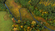 Jesienny mazurski las, widok z drona na jesienny las z zakolem rzeki, jesień na mazurach