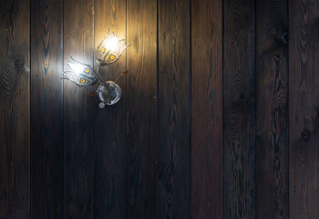 Wall Mural - chandelier in the shape of a flower on a wooden wall