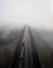 Aerial Landscape Of A Lost Hopeless Person On A Railway Line In A Depression Concept