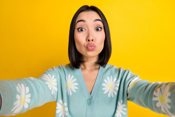 Sticker - Portrait of good mood cheerful girl with straight hairdo wear blue cardigan shooting selfie send kiss isolated on yellow color background