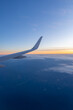 Beautiful sunset, sky on the top view, airplane flying view from inside window aircraft of Traveling vertical image..