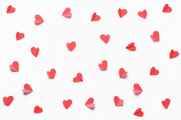 Wall Mural - Hearts cut out from white paper. Festive background for valentine's day.