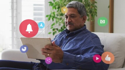 Poster - Animation of network with social media icons over biracial man using tablet