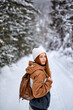 © Roman - Rear view On Good-looking Lady In Warm Outfit Walking In Winter Forest Alone, Enjoying The view. Beautiful Caucasian Lady With Backpack Stand Taking A Break During Walk, Hike, Look At Camera