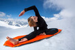© Cavan Images - A female alpine climber practicing yoga postures at the ridge of Aiguille du Midi, Chamonix, France on May 29 2012.