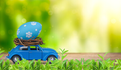 Retro toy car carrying an Easter egg on the roof. Easter concept.