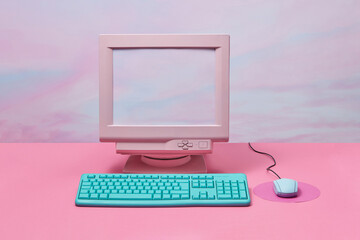 Vintage monitor with computer keyboard and mouse.