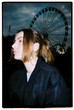© Nikita Sursin/Stocksy - woman in the amusement park