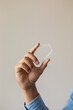 © Demetr White/Stocksy - aligners in hand