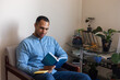 © Demetr White/Stocksy - happy guy reading a book