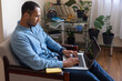 © Demetr White/Stocksy - man typing in laptop