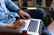 © Demetr White/Stocksy - trader's hands at work at the laptop