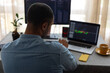 © Demetr White/Stocksy - photo from the back of a man behind a pc