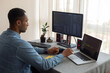 © Demetr White/Stocksy - trader working at home by the window