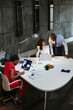 © BONNINSTUDIO/Stocksy - Diverse colleagues reviewing a presentation in office