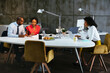 © BONNINSTUDIO/Stocksy - Diverse colleagues in a business meeting