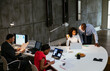 © BONNINSTUDIO/Stocksy - Diverse colleagues working in workspace