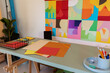 © Valentina Barreto/Stocksy - Colorful designer office desk