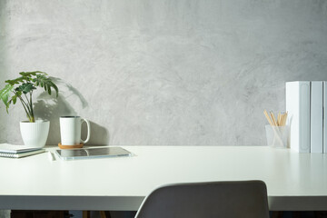 Aufkleber - Modern workplace with tablet, books, houseplant and coffee cup on white table. Copy space for your text and product display .
