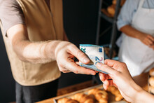 Customer Paying In Bakery 